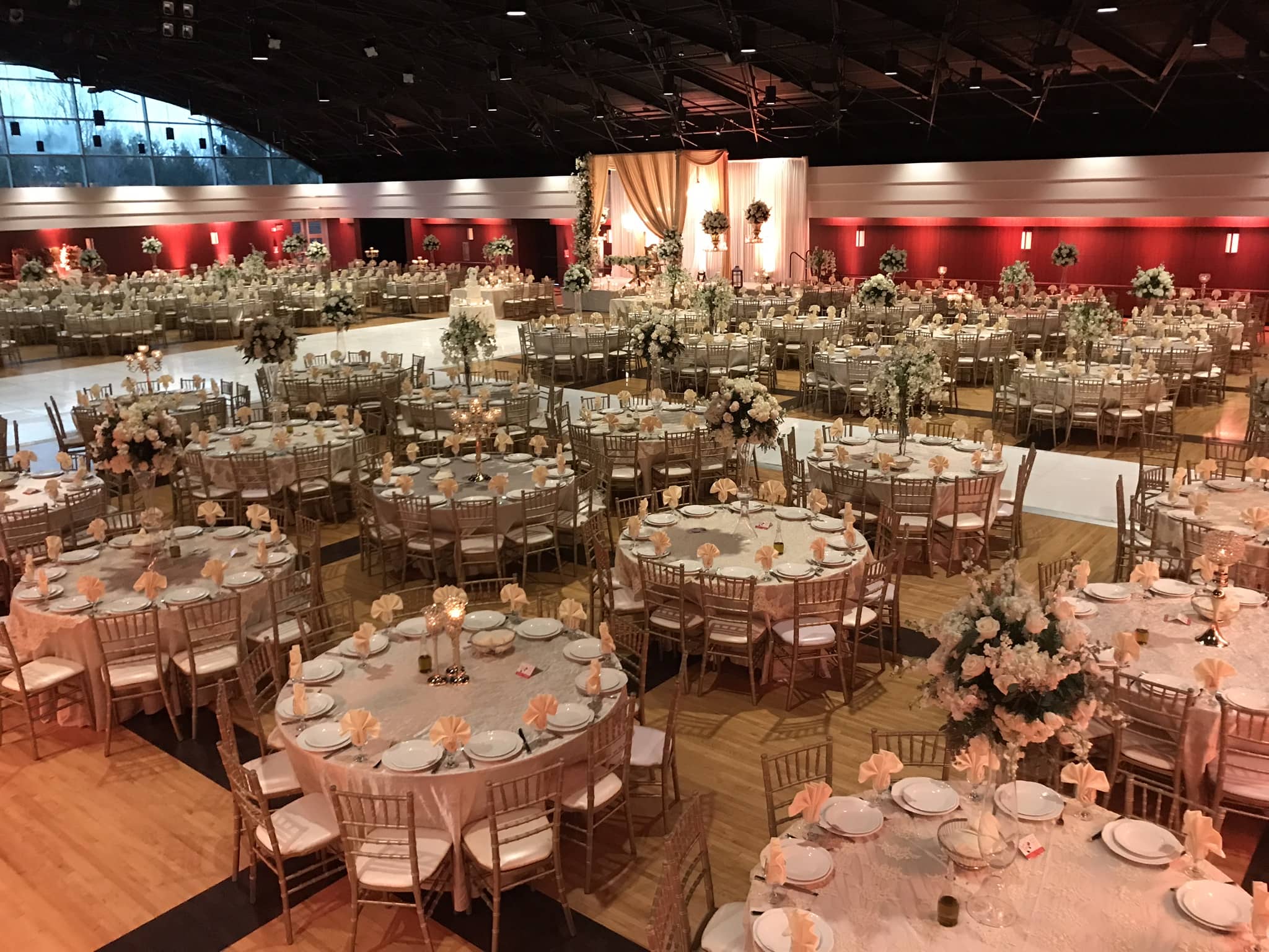 Elegant wedding setup in Lincoln Ballroom with round tables, floral centerpieces, and soft lighting.